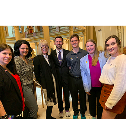 students inside colorado capitol with CO representative